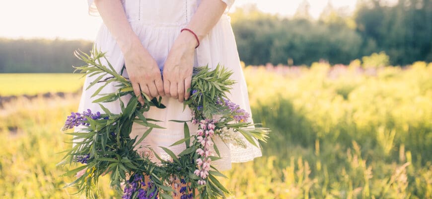 Female,Hands,Holding,A,Wreath,Of,Wildflowers.,Nature.